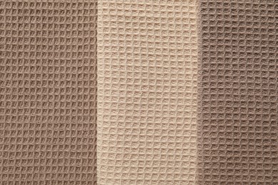 Photo of Different colorful waffle towels as background, top view