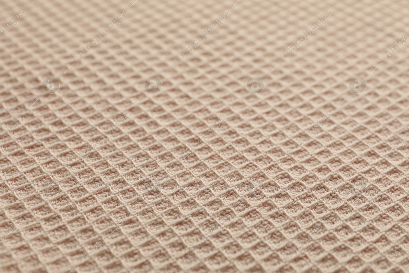 Clean beige waffle towel as background, closeup Photo of Clean beige waffle towel as background, closeup