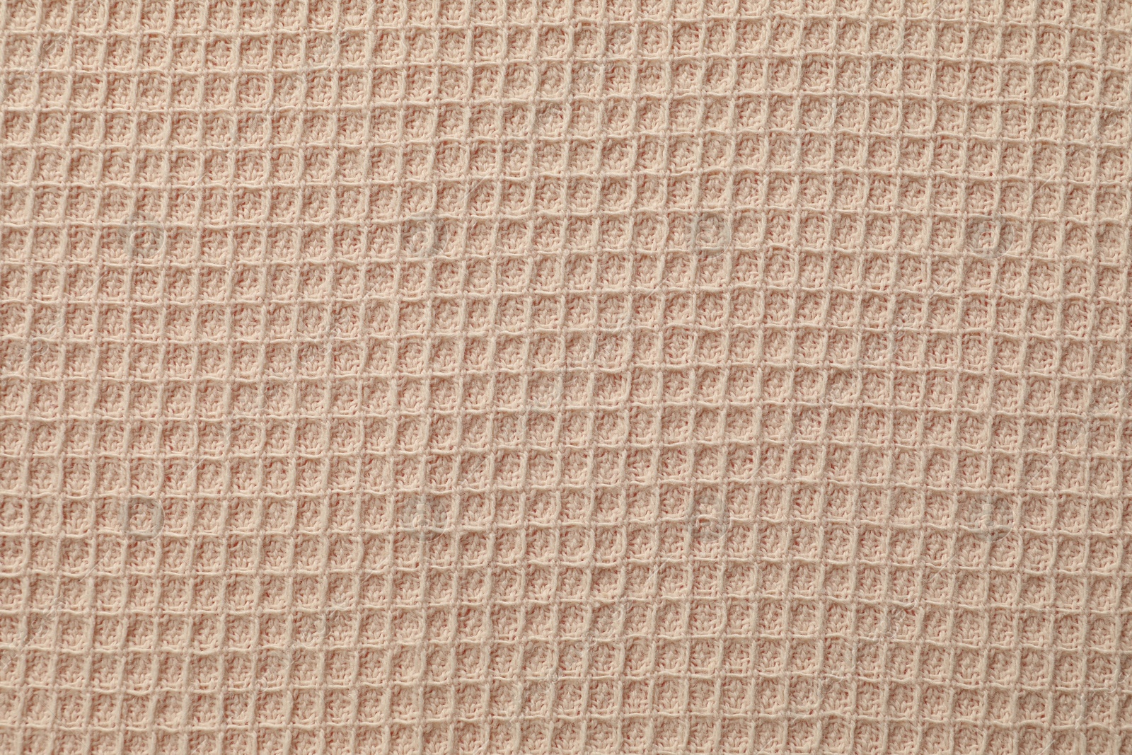 Clean beige waffle towel as background, top view Photo of Clean beige waffle towel as background, top view