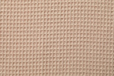 Photo of Clean beige waffle towel as background, top view