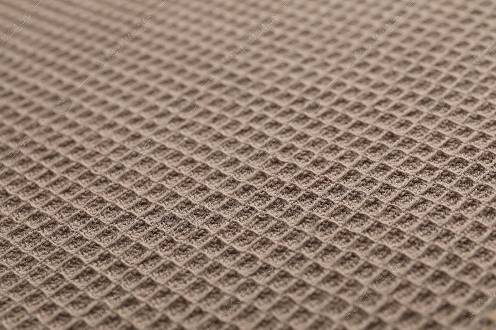 Clean brown waffle towel as background, closeup Photo of Clean brown waffle towel as background, closeup