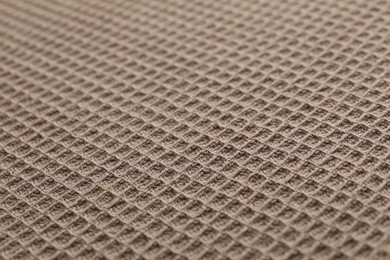 Photo of Clean brown waffle towel as background, closeup