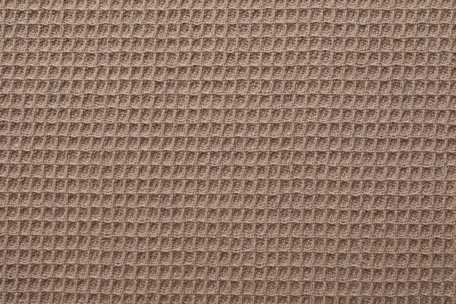 Clean brown waffle towel as background, top view Photo of Clean brown waffle towel as background, top view