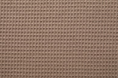 Photo of Clean brown waffle towel as background, top view