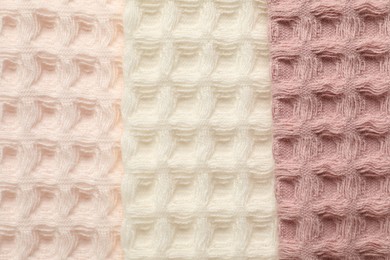 Photo of Different colorful waffle towels as background, top view