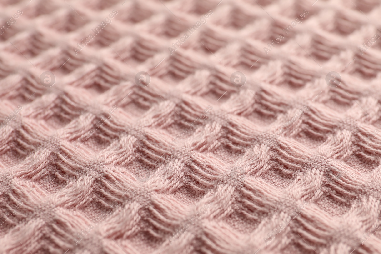 Clean pink waffle towel as background, closeup Photo of Clean pink waffle towel as background, closeup