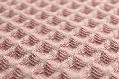Photo of Clean pink waffle towel as background, closeup