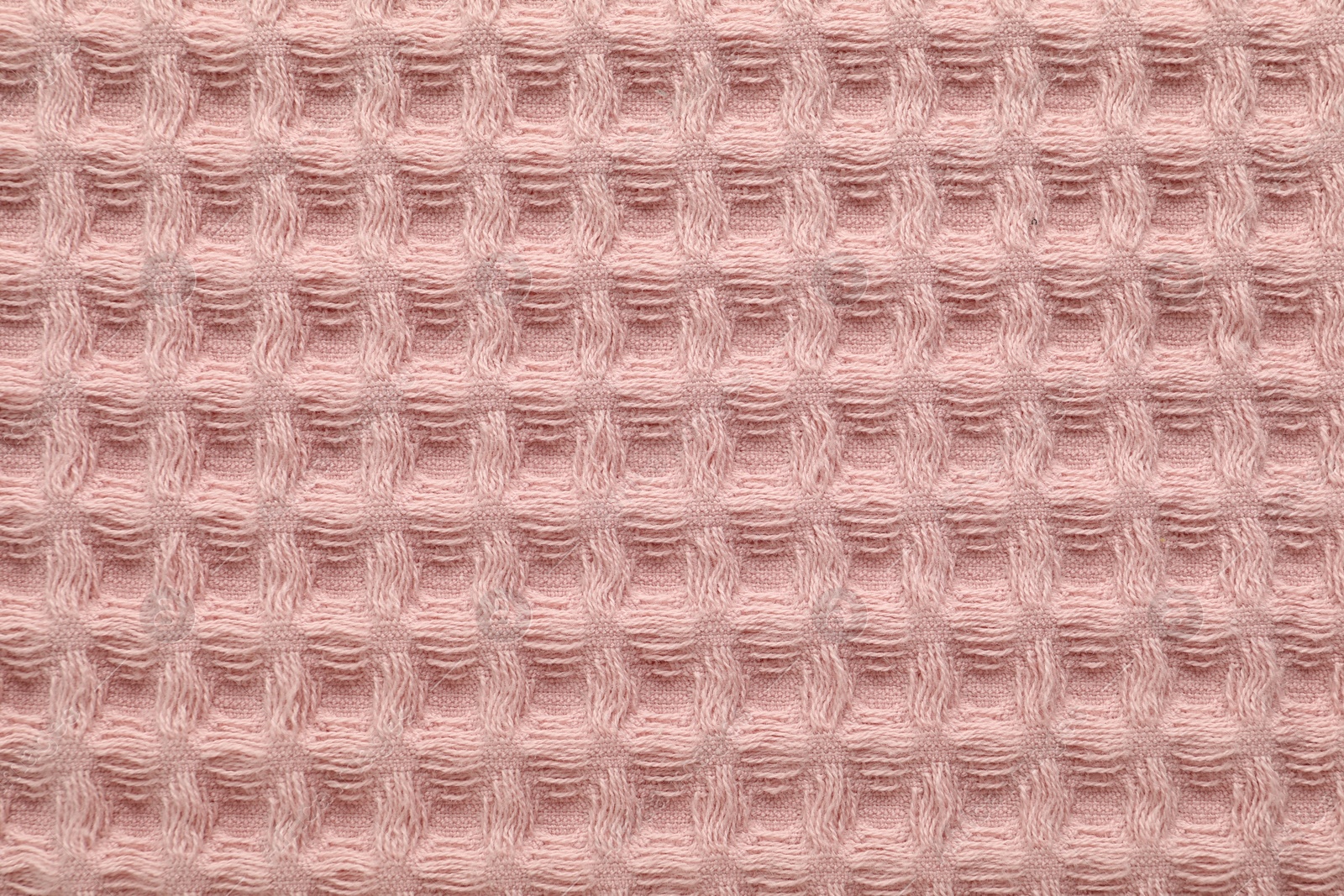 Clean pink waffle towel as background, top view Photo of Clean pink waffle towel as background, top view