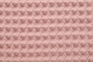 Photo of Clean pink waffle towel as background, top view