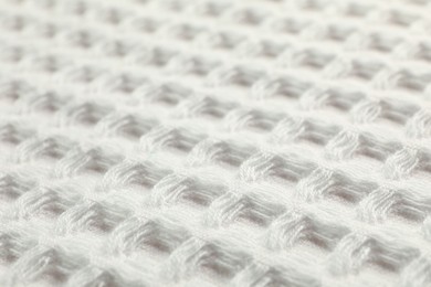 Photo of Clean white waffle towel as background, closeup