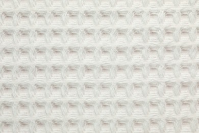 Photo of Clean white waffle towel as background, top view