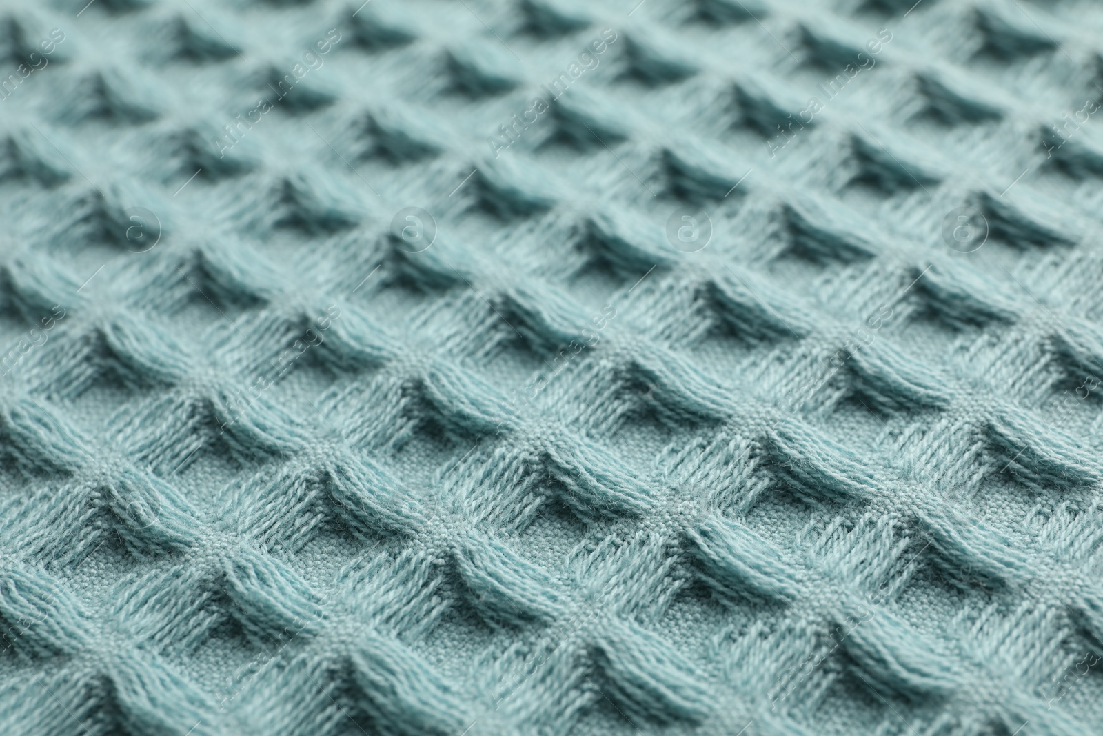 Clean light blue waffle towel as background, closeup Photo of Clean light blue waffle towel as background, closeup