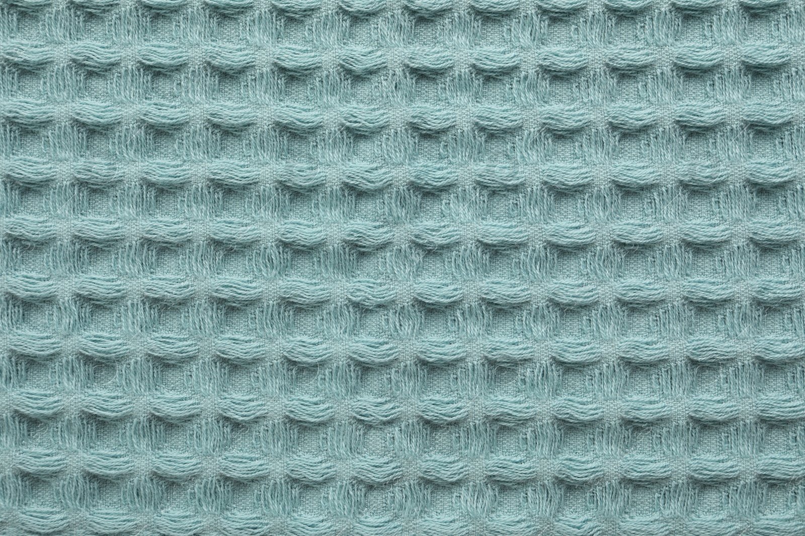 Clean light blue waffle towel as background, top view Photo of Clean light blue waffle towel as background, top view