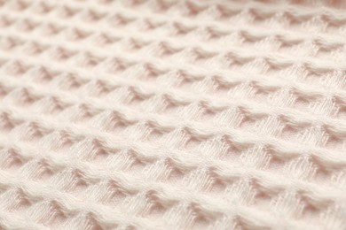 Photo of Clean beige waffle towel as background, closeup