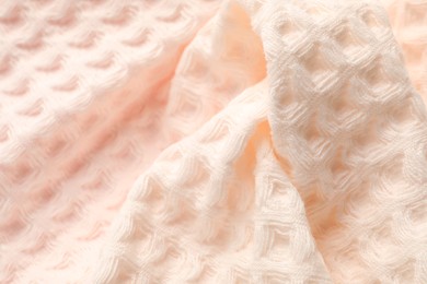 Photo of Clean beige waffle towel as background, closeup