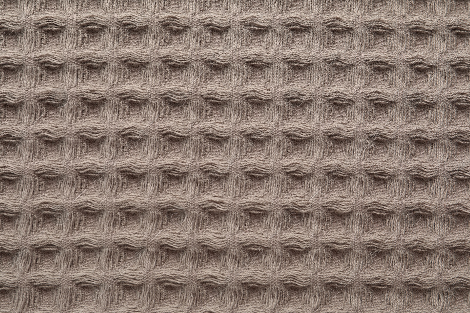 Clean brown waffle towel as background, top view Photo of Clean brown waffle towel as background, top view