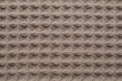 Photo of Clean brown waffle towel as background, top view