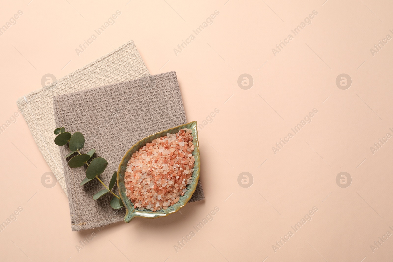 Clean waffle towels, sea salt and eucalyptus branch on beige background, top view. Space for text Photo of Clean waffle towels, sea salt and eucalyptus branch on beige background, top view. Space for text