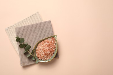 Photo of Clean waffle towels, sea salt and eucalyptus branch on beige background, top view. Space for text