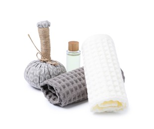 Photo of Clean waffle towels, massage bag and cosmetic product isolated on white