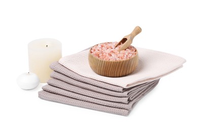 Photo of Clean waffle towels, candles and sea salt isolated on white