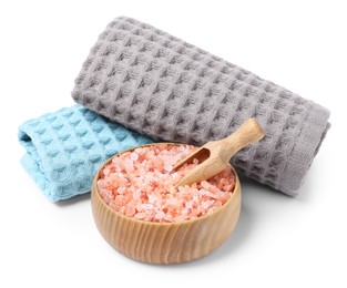 Photo of Clean waffle towels and sea salt isolated on white