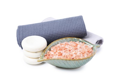 Photo of Clean waffle towels, sea salt and spa stones isolated on white
