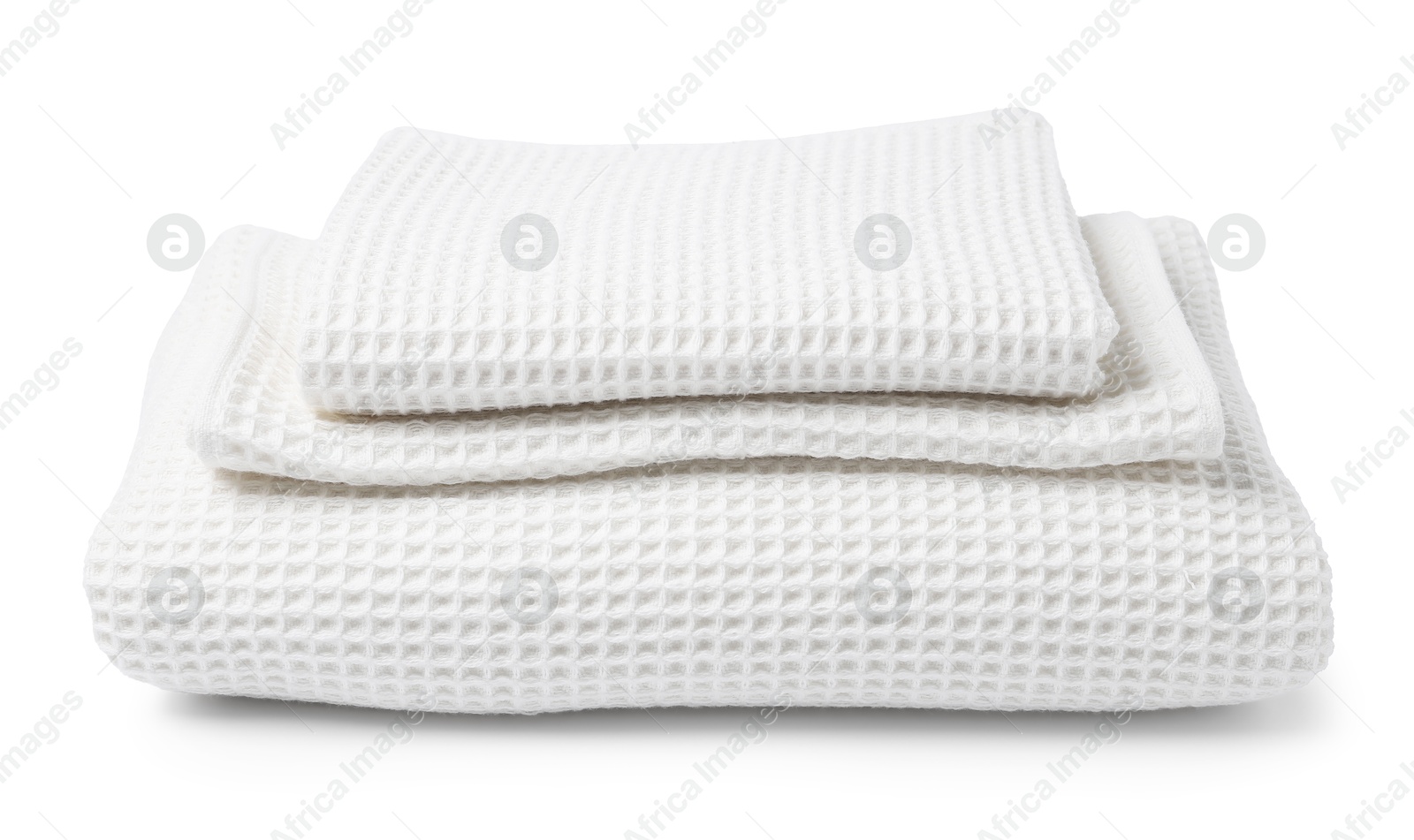Stack of clean waffle towels isolated on white Photo of Stack of clean waffle towels isolated on white