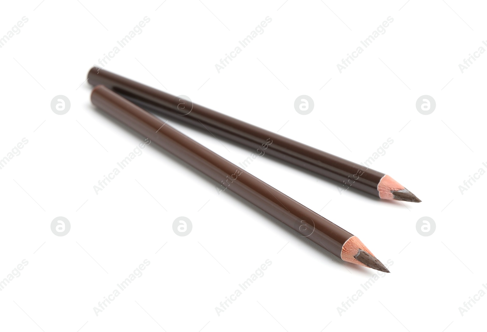 Two different eyebrow pencils isolated on white Photo of Two different eyebrow pencils isolated on white