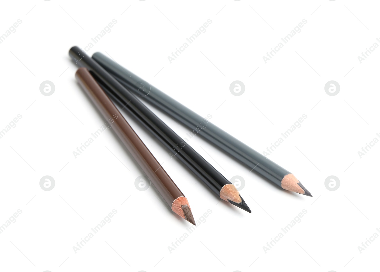 Three different eyebrow pencils isolated on white Photo of Three different eyebrow pencils isolated on white