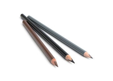 Photo of Three different eyebrow pencils isolated on white