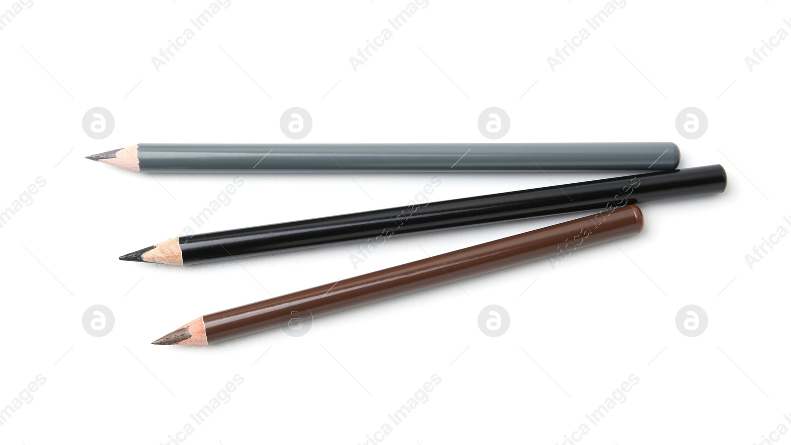 Different eyebrow pencils isolated on white, top view Photo of Different eyebrow pencils isolated on white, top view