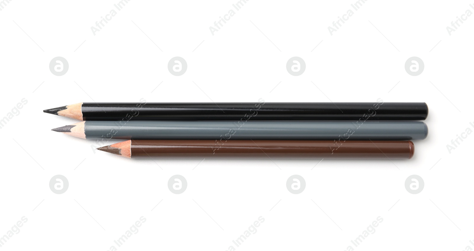 Different eyebrow pencils isolated on white, top view Photo of Different eyebrow pencils isolated on white, top view