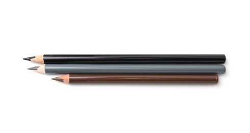 Photo of Different eyebrow pencils isolated on white, top view