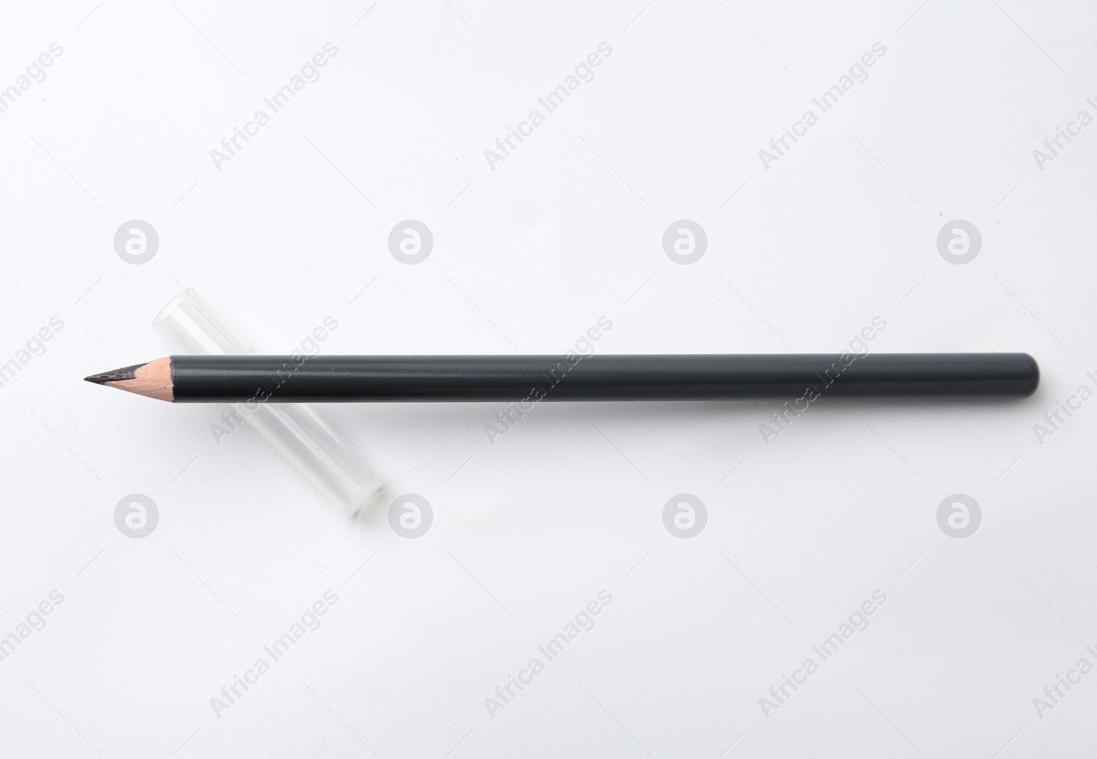 Black eyebrow pencil on white background, top view Photo of Black eyebrow pencil on white background, top view