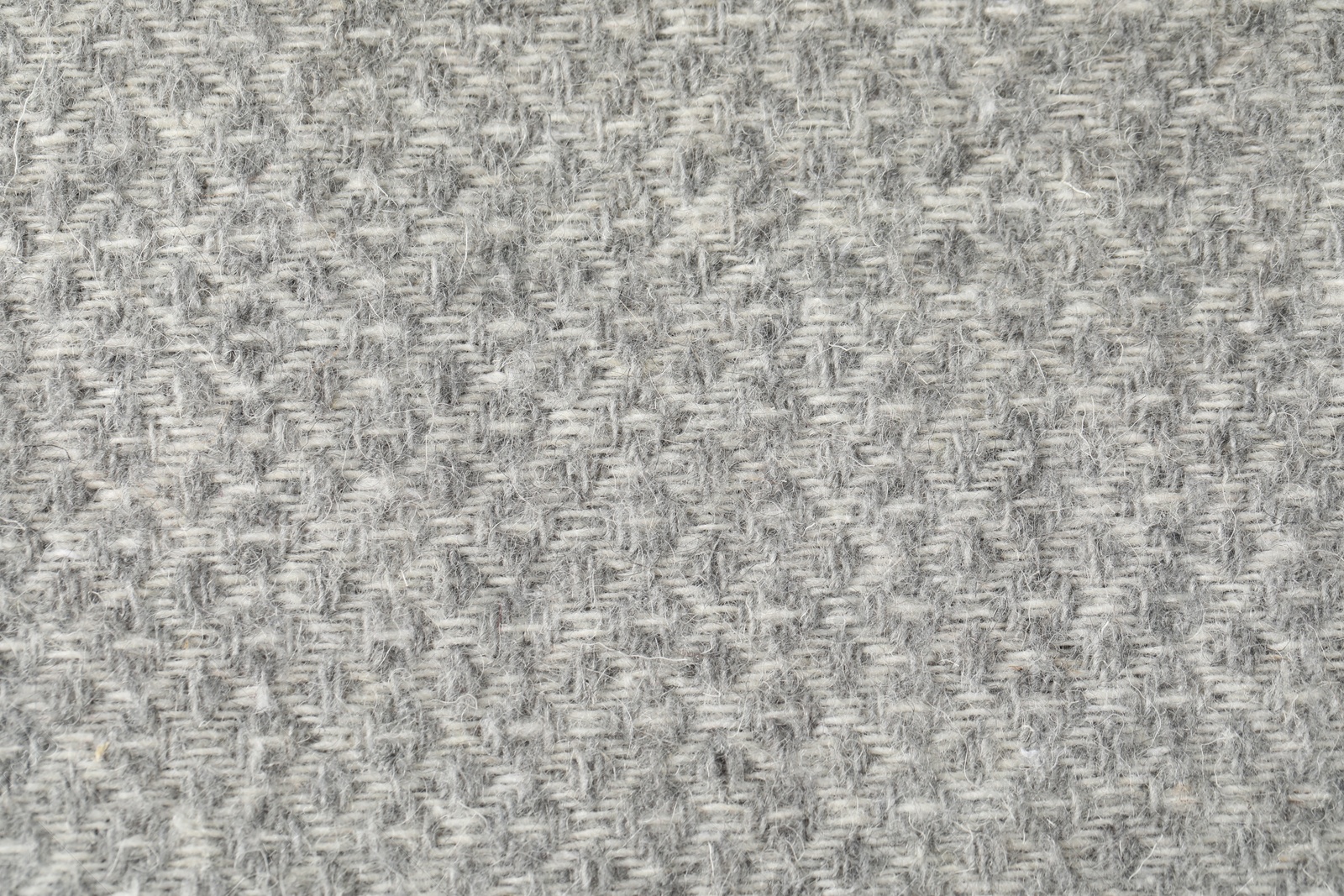 Texture of light grey wool fabric as background, top view Photo of Texture of light grey wool fabric as background, top view