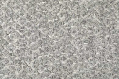 Photo of Texture of light grey wool fabric as background, top view
