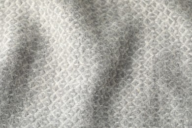 Photo of Texture of light grey wool fabric as background, top view