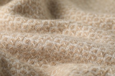 Photo of Texture of beige wool fabric as background, closeup