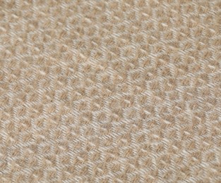 Photo of Texture of beige wool fabric as background, top view