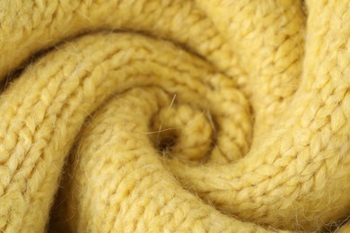 Photo of Texture of yellow wool fabric as background, closeup