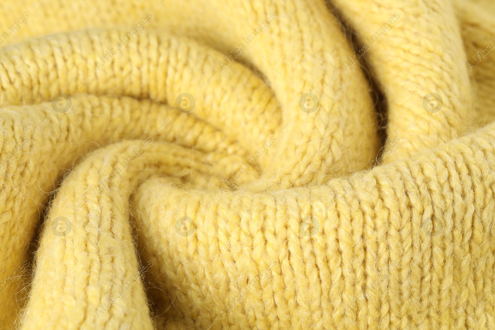 Texture of yellow wool fabric as background, closeup Photo of Texture of yellow wool fabric as background, closeup