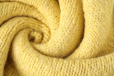 Photo of Texture of yellow wool fabric as background, top view
