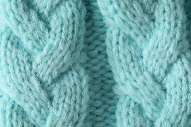 Photo of Texture of turquoise wool fabric as background, top view