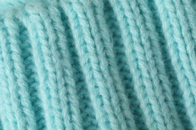 Photo of Texture of turquoise wool fabric as background, top view