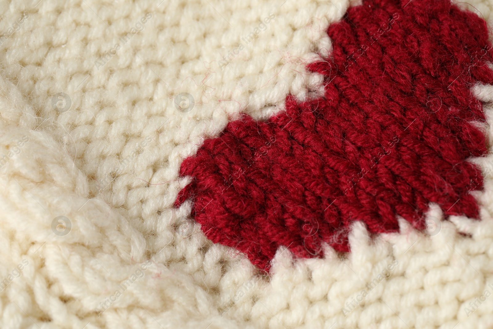 Texture of beige wool fabric with heart as background, closeup Photo of Texture of beige wool fabric with heart as background, closeup