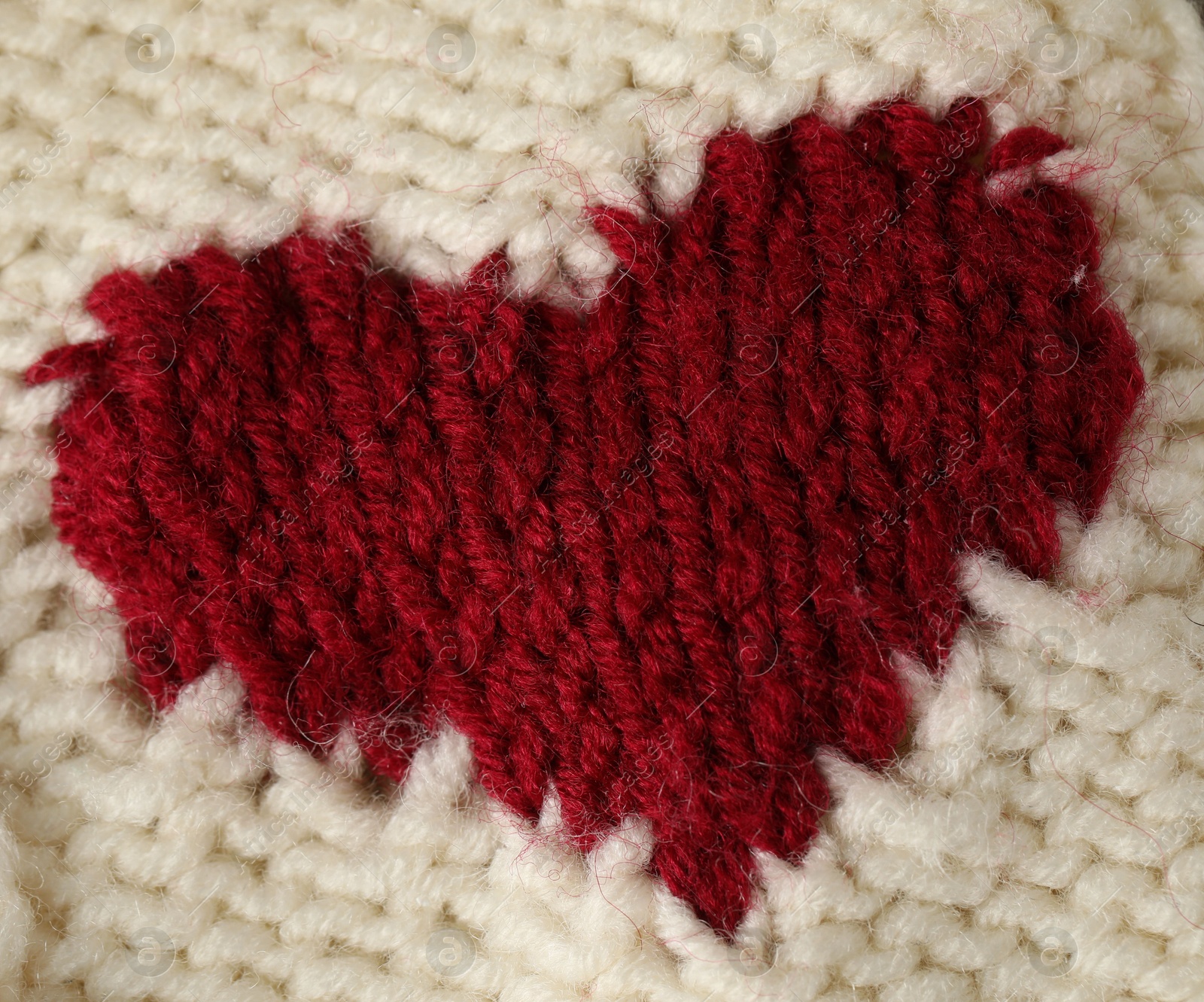 Texture of beige wool fabric with heart as background, top view Photo of Texture of beige wool fabric with heart as background, top view