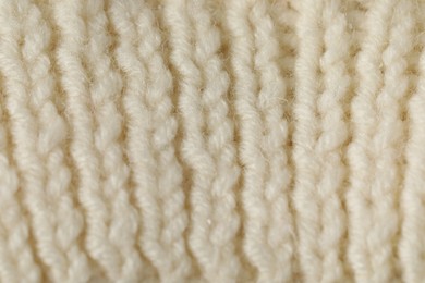 Photo of Texture of beige wool fabric as background, closeup