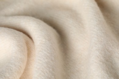 Photo of Texture of beige wool fabric as background, closeup