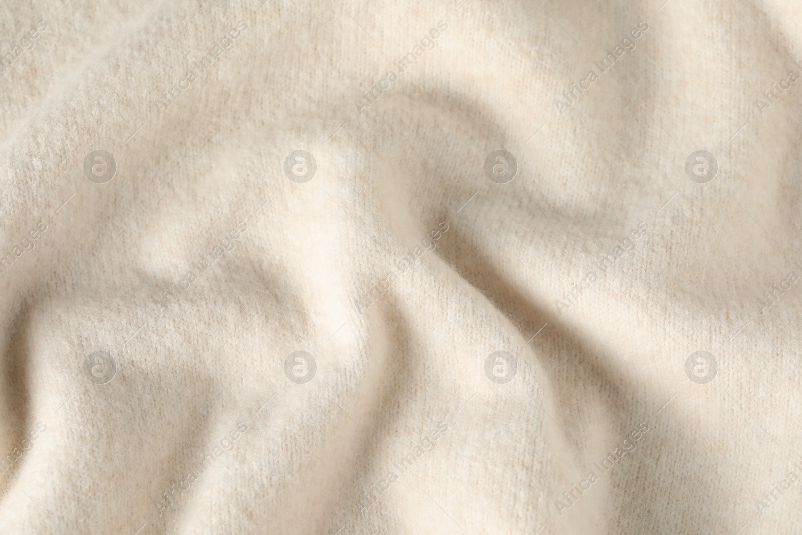 Texture of beige wool fabric as background, top view Photo of Texture of beige wool fabric as background, top view